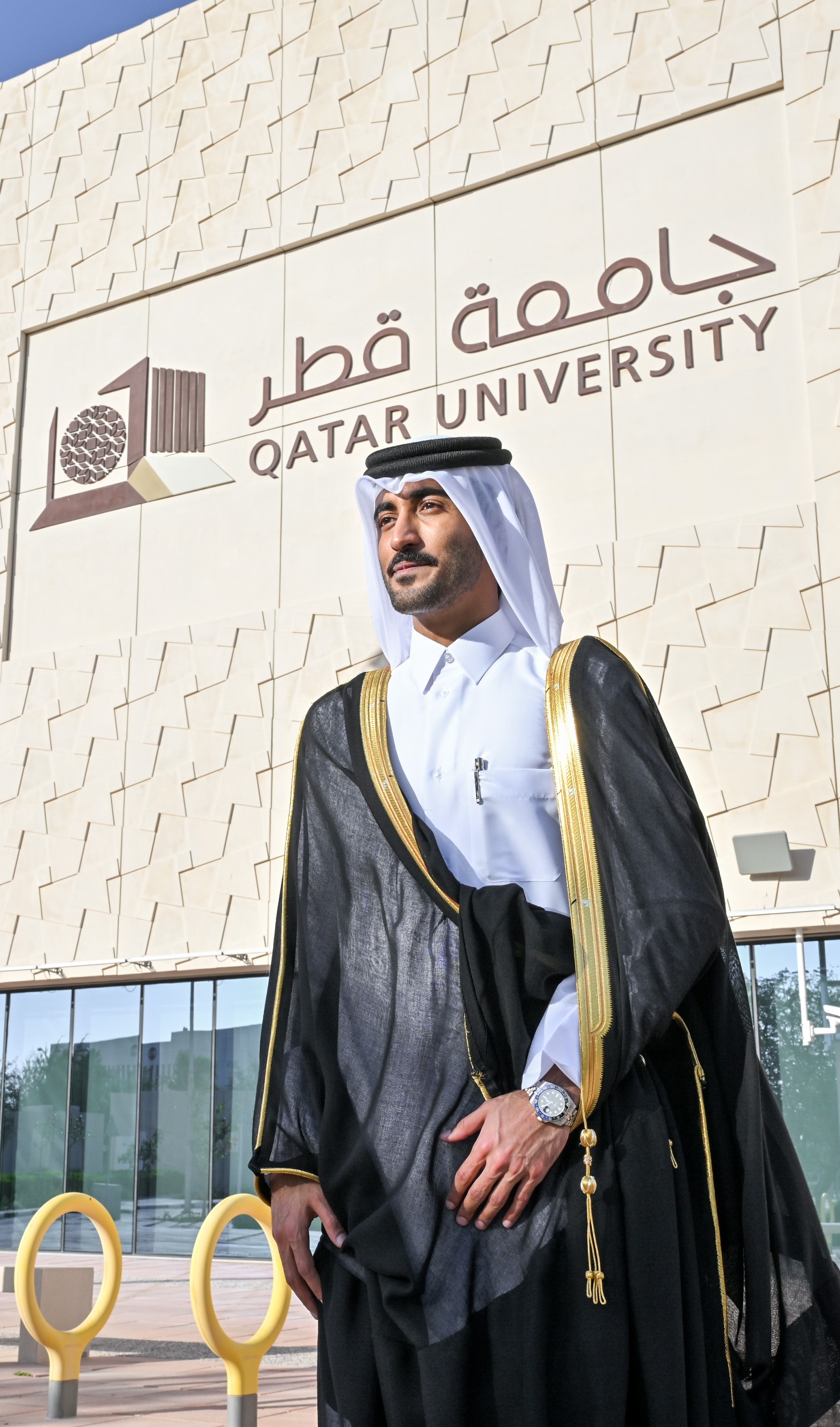 QU Male Graduation Bisht